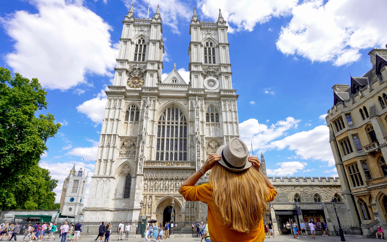 Westminster Abbey facade with visitor during 3-hour walking tour, London.